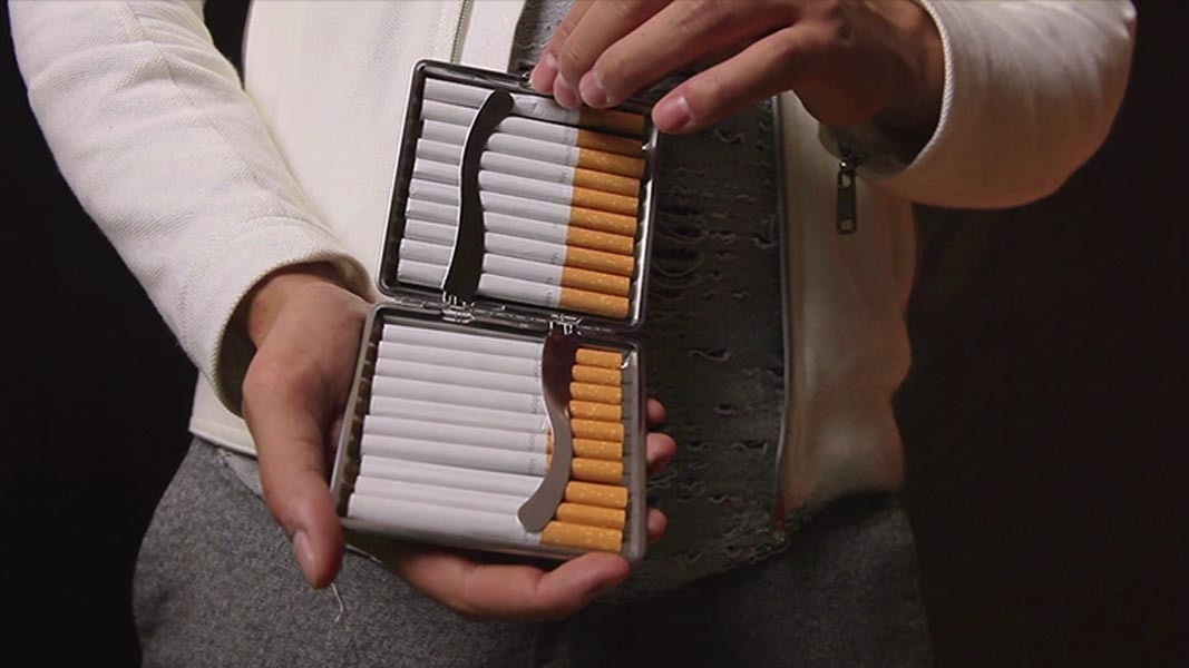Open metal cigarette case with neatly arranged cigarettes