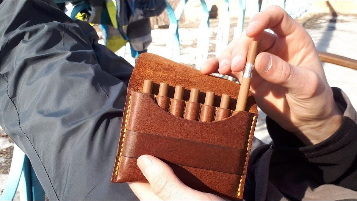Vintage and modern cigarette cases displayed together